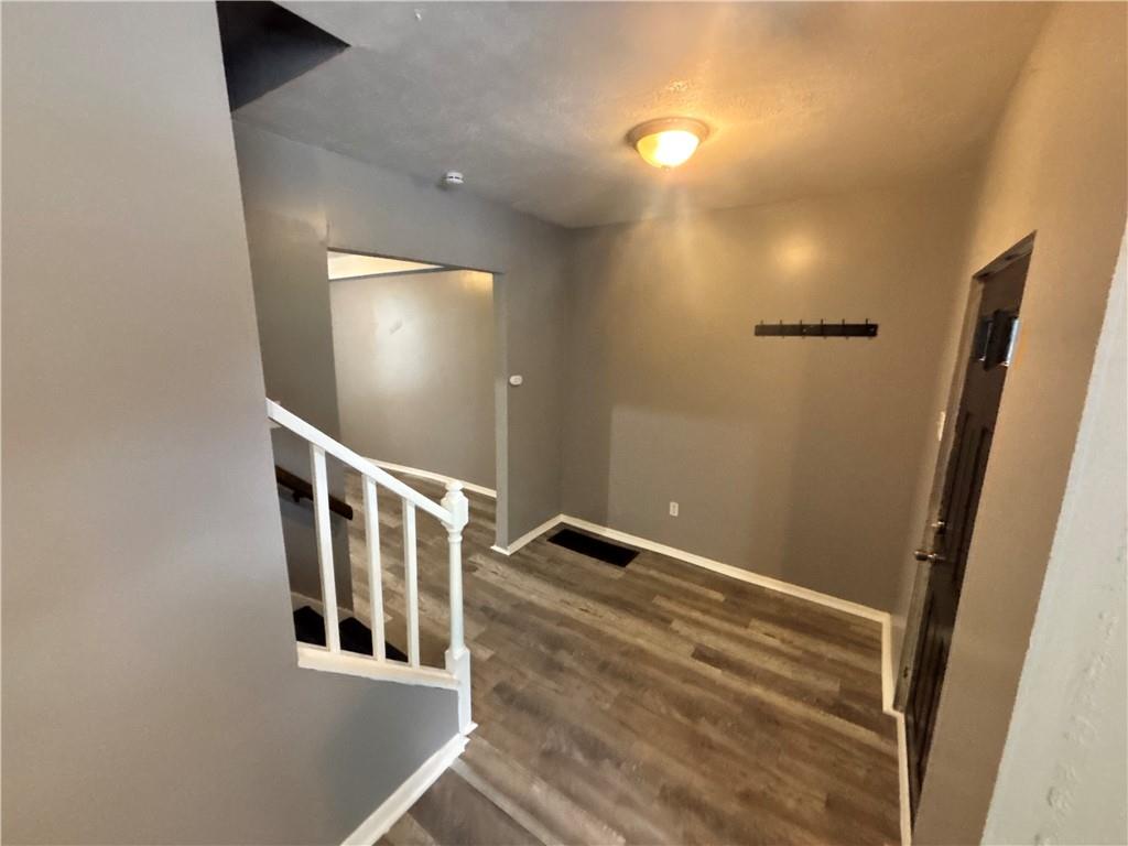 335 Cedarhurst Street Pittsburgh, PA 15210 - Photo 5 of 28 a view of an entryway with wooden floor