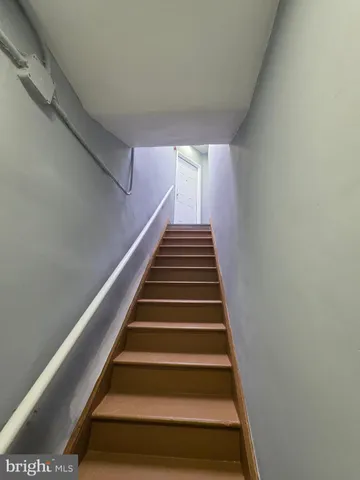 a kitchen with a cabinets wooden floor and a sink