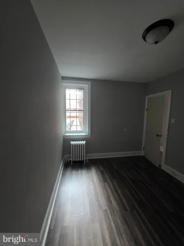 a kitchen with a refrigerator and a stove top oven