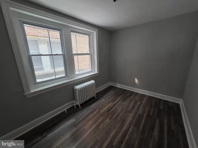 a view of a door with wooden fence