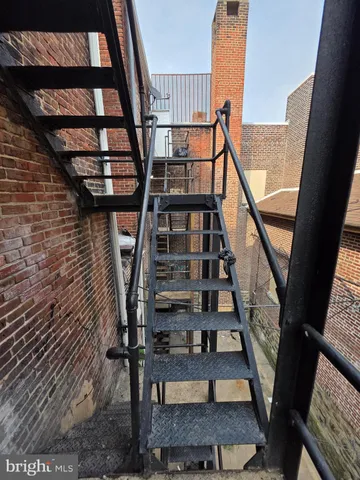 a view of room with wooden floor