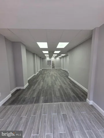 a view of empty room with wooden walls