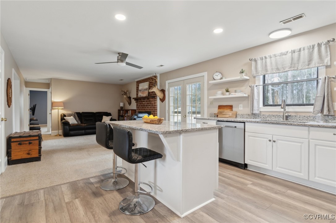17830 Stage Road Barhamsville, VA 23011 - Photo 12 of 48 Kitchen with light stone countertops, visible vent