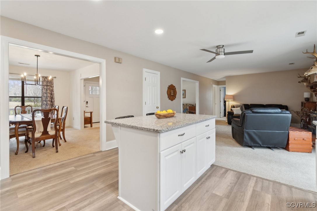17830 Stage Road Barhamsville, VA 23011 - Photo 15 of 48 Kitchen featuring light wood-style floors, a kitch