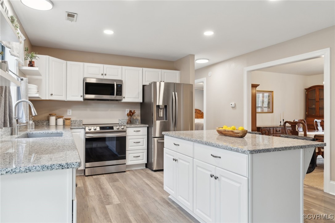 17830 Stage Road Barhamsville, VA 23011 - Photo 16 of 48 Kitchen with a sink, light wood-type flooring, app