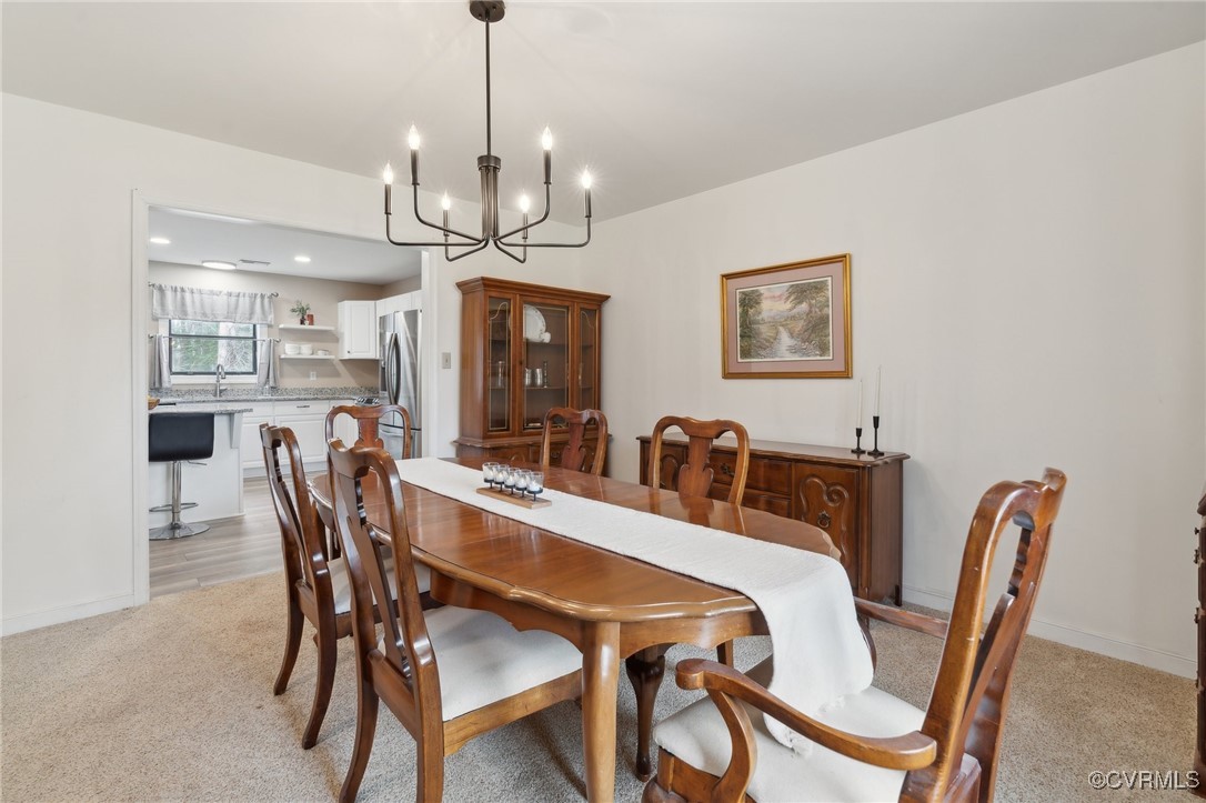 17830 Stage Road Barhamsville, VA 23011 - Photo 18 of 48 Dining area with baseboards, light carpet, and an