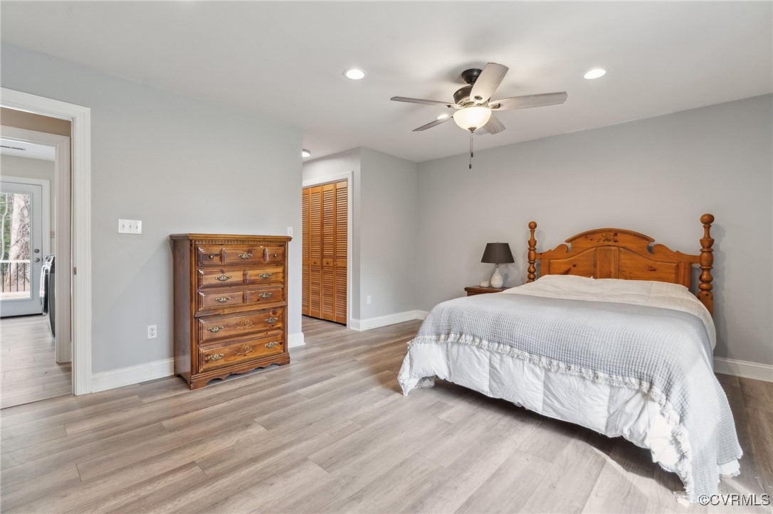 17830 Stage Road Barhamsville, VA 23011 - Photo 22 of 48 Bedroom with light wood-type flooring, a closet, b