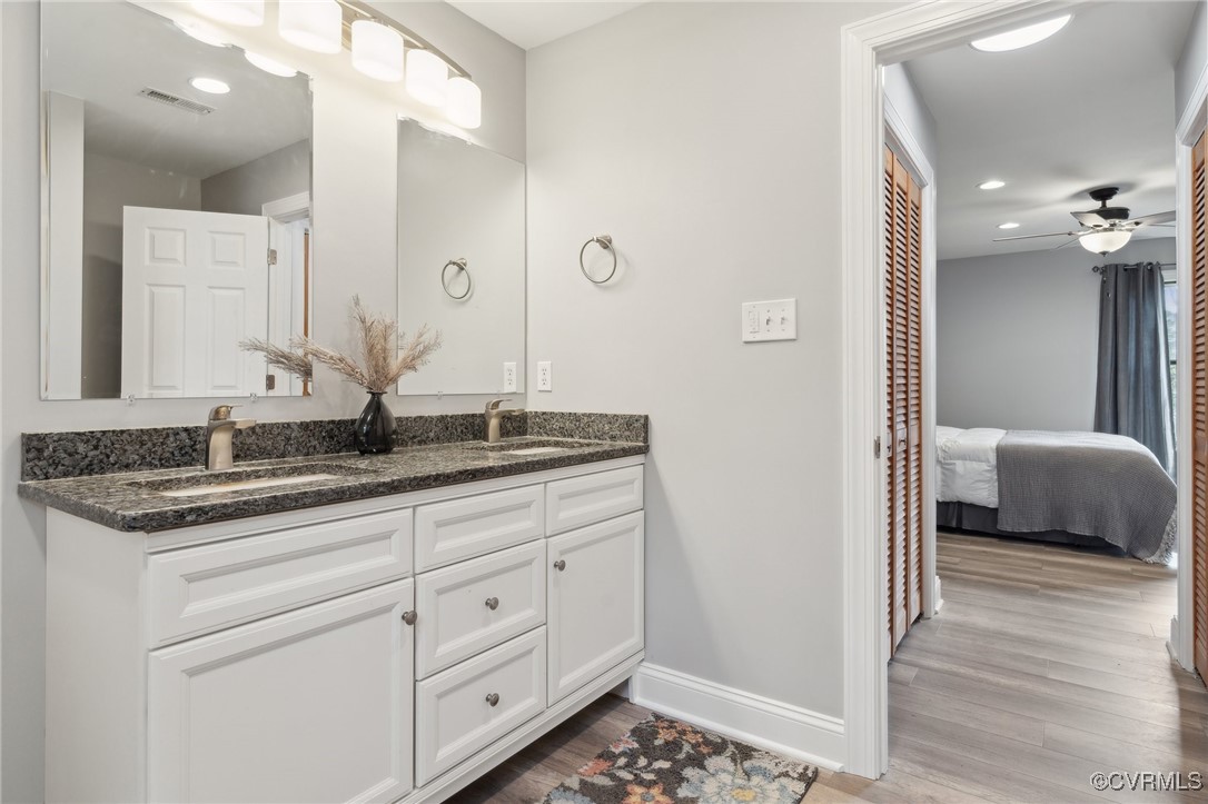 17830 Stage Road Barhamsville, VA 23011 - Photo 26 of 48 Bathroom featuring a sink, visible vents, wood fin