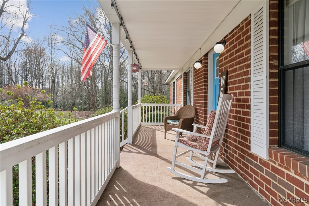 Balcony featuring covered porch