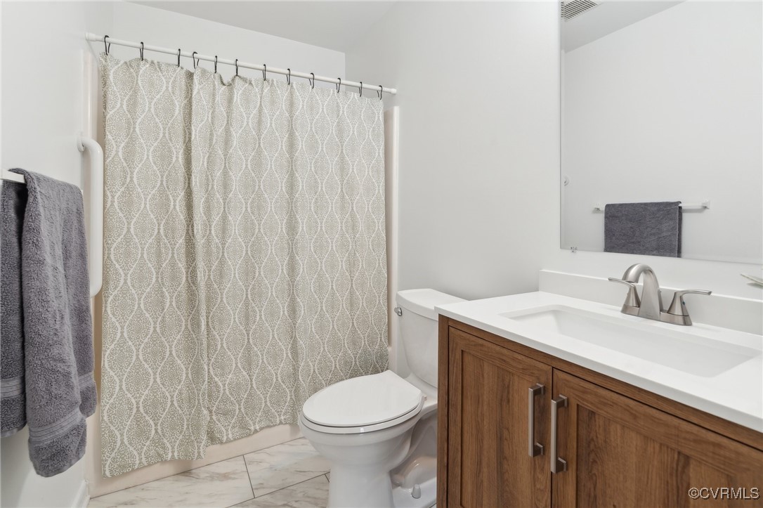 17830 Stage Road Barhamsville, VA 23011 - Photo 31 of 48 Full bathroom with visible vents, toilet, marble f