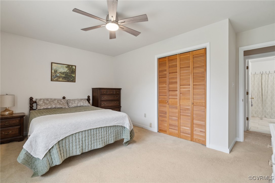 17830 Stage Road Barhamsville, VA 23011 - Photo 33 of 48 Bedroom with a closet, baseboards, light colored c