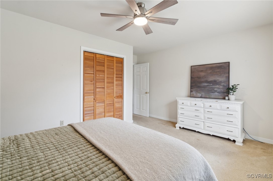 17830 Stage Road Barhamsville, VA 23011 - Photo 34 of 48 Bedroom with a closet, baseboards, light colored c