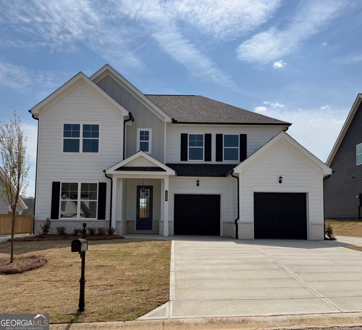 a front view of a house with yard