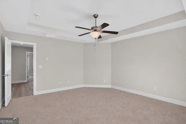 a bathroom with a granite countertop sink a large mirror and a vanity