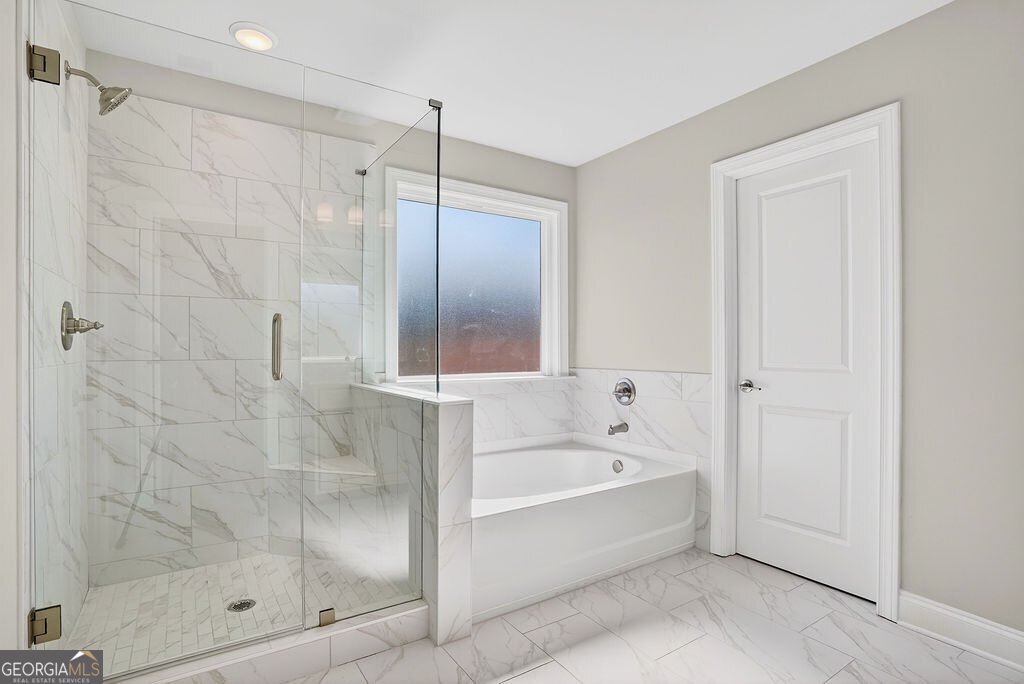 152 Classic Overlook Homer, GA 30547 - Photo 21 of 36 a spacious bathroom with a bathtub and a shower