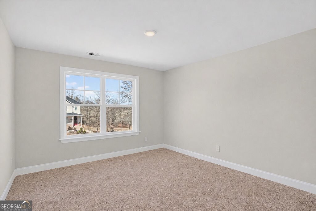 152 Classic Overlook Homer, GA 30547 - Photo 29 of 36 an empty room with a window