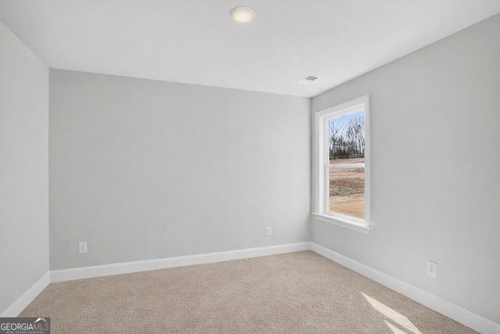 152 Classic Overlook Homer, GA 30547 - Photo 3 of 36 an empty room with windows