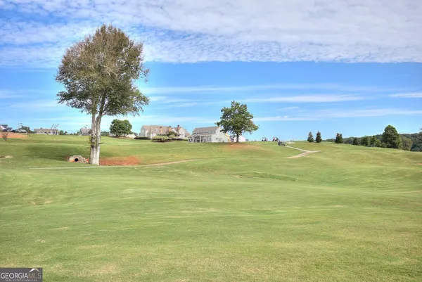 a view of entryway and hall with dining room