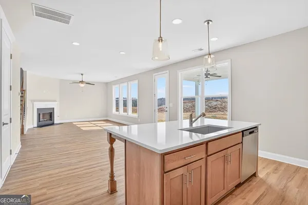 a kitchen with a sink stove and refrigerator