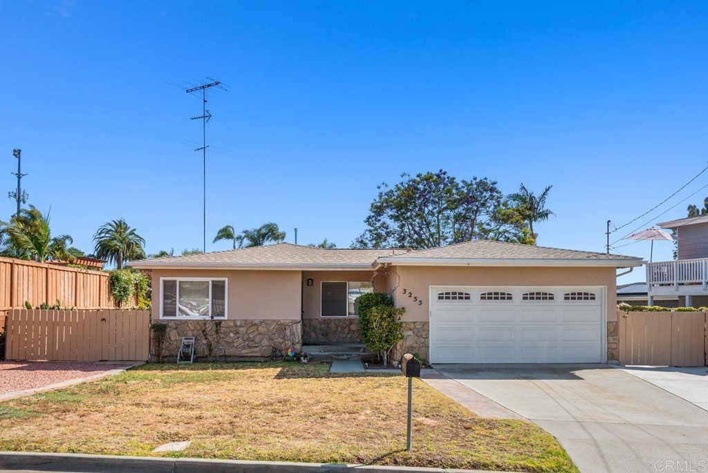 3255 Canyon Street Carlsbad, CA 92008 - Photo 1 of 33 a front view of a house with a yard and potted plants