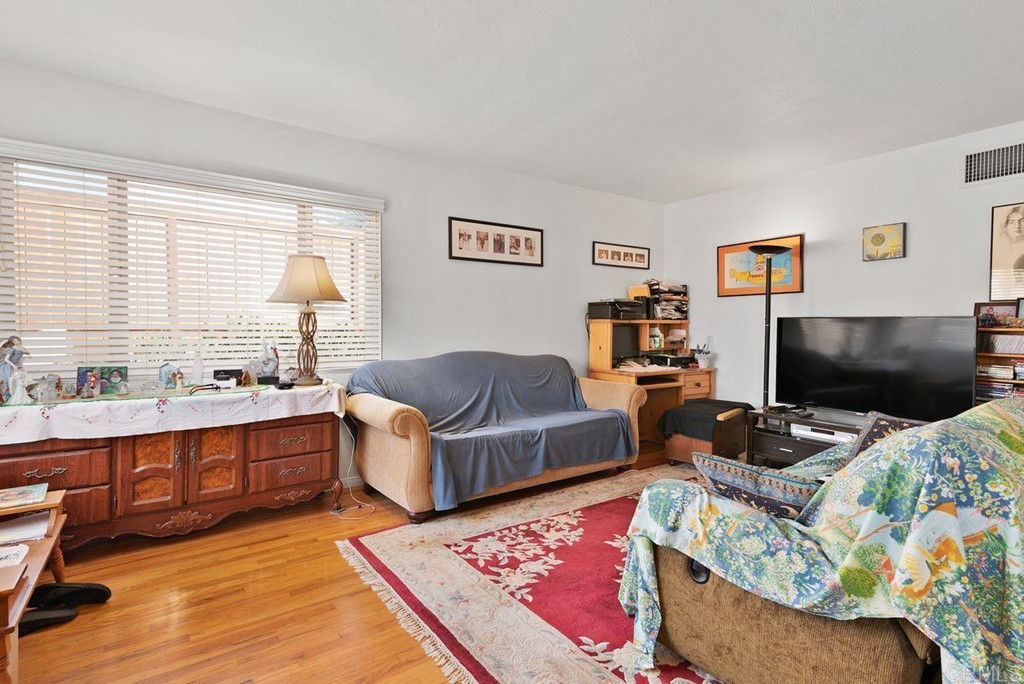 3255 Canyon Street Carlsbad, CA 92008 - Photo 11 of 33 a living room with furniture and a flat screen tv