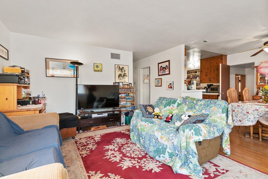 3255 Canyon Street Carlsbad, CA 92008 - Photo 12 of 33 a living room with furniture and a flat screen tv