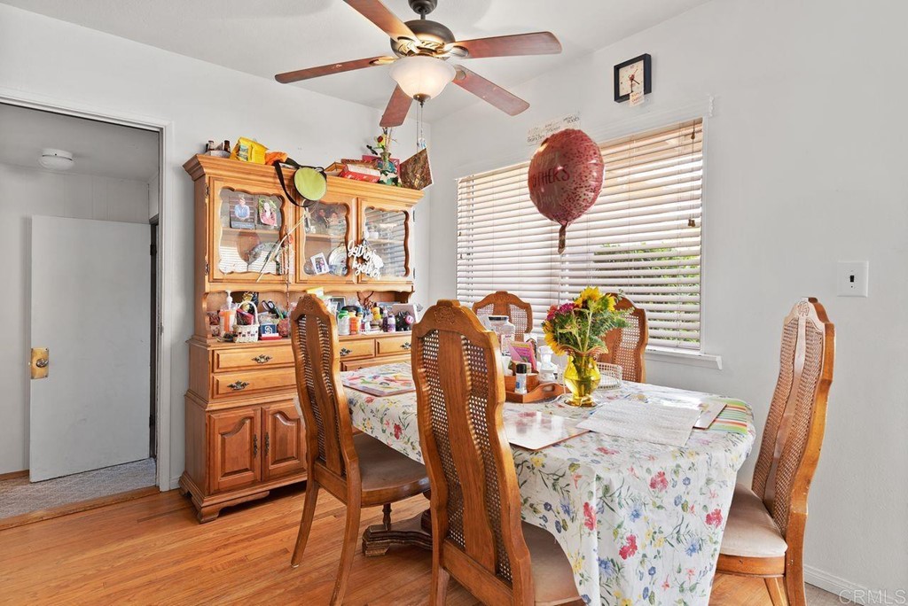 3255 Canyon Street Carlsbad, CA 92008 - Photo 15 of 33 a view of a dining room with furniture and wooden floor