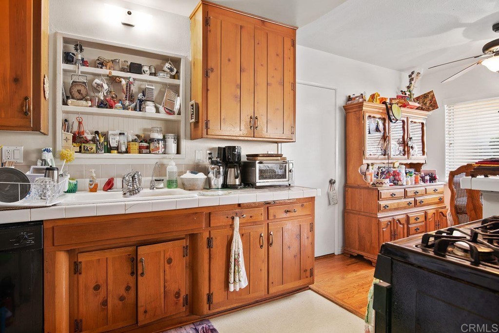 3255 Canyon Street Carlsbad, CA 92008 - Photo 21 of 33 a kitchen with stainless steel appliances a sink a stove and a refrigerator