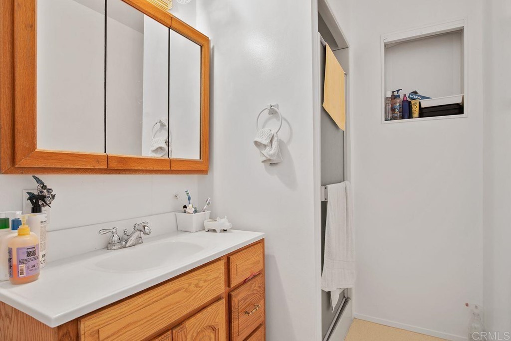 3255 Canyon Street Carlsbad, CA 92008 - Photo 24 of 33 a bathroom with a sink and a mirror