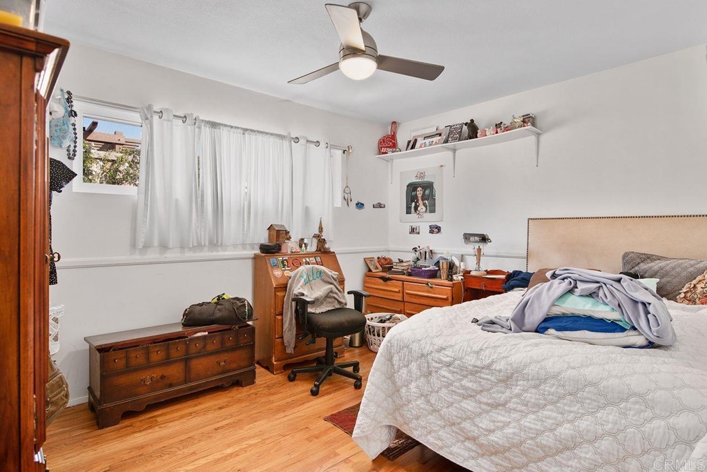 3255 Canyon Street Carlsbad, CA 92008 - Photo 27 of 33 a bedroom with furniture and a wooden floor