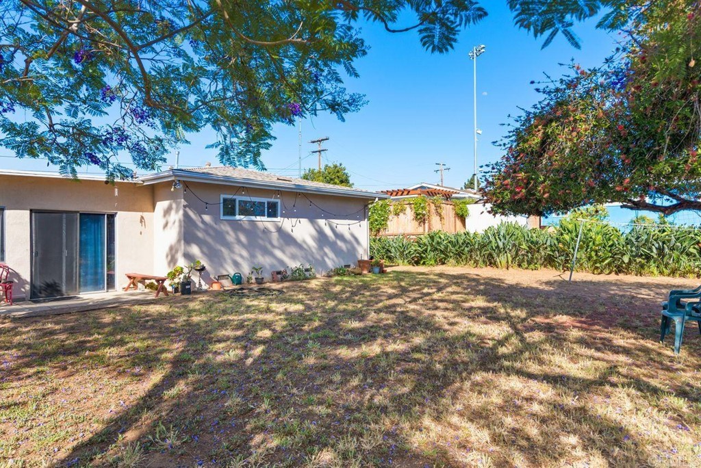 3255 Canyon Street Carlsbad, CA 92008 - Photo 30 of 33 a view of a house with a tree in the background