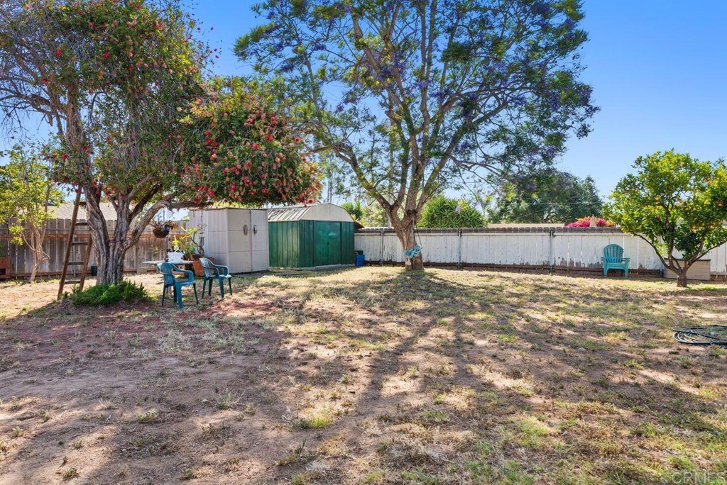 3255 Canyon Street Carlsbad, CA 92008 - Photo 32 of 33 a view of a backyard with a large tree