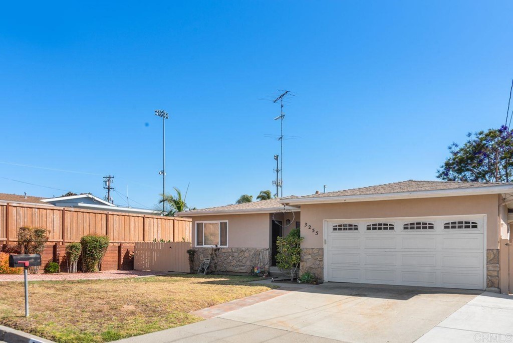 3255 Canyon Street Carlsbad, CA 92008 - Photo 9 of 33 a front view of a house with a yard