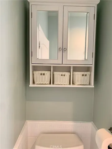 a kitchen with stainless steel appliances granite countertop a refrigerator a stove and a microwave oven with cabinets