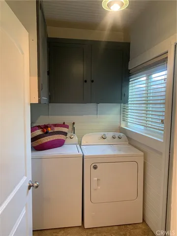 a view of a balcony with wooden floor and fence