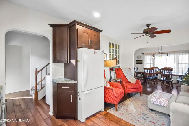 a view of a livingroom with furniture and a flat screen tv
