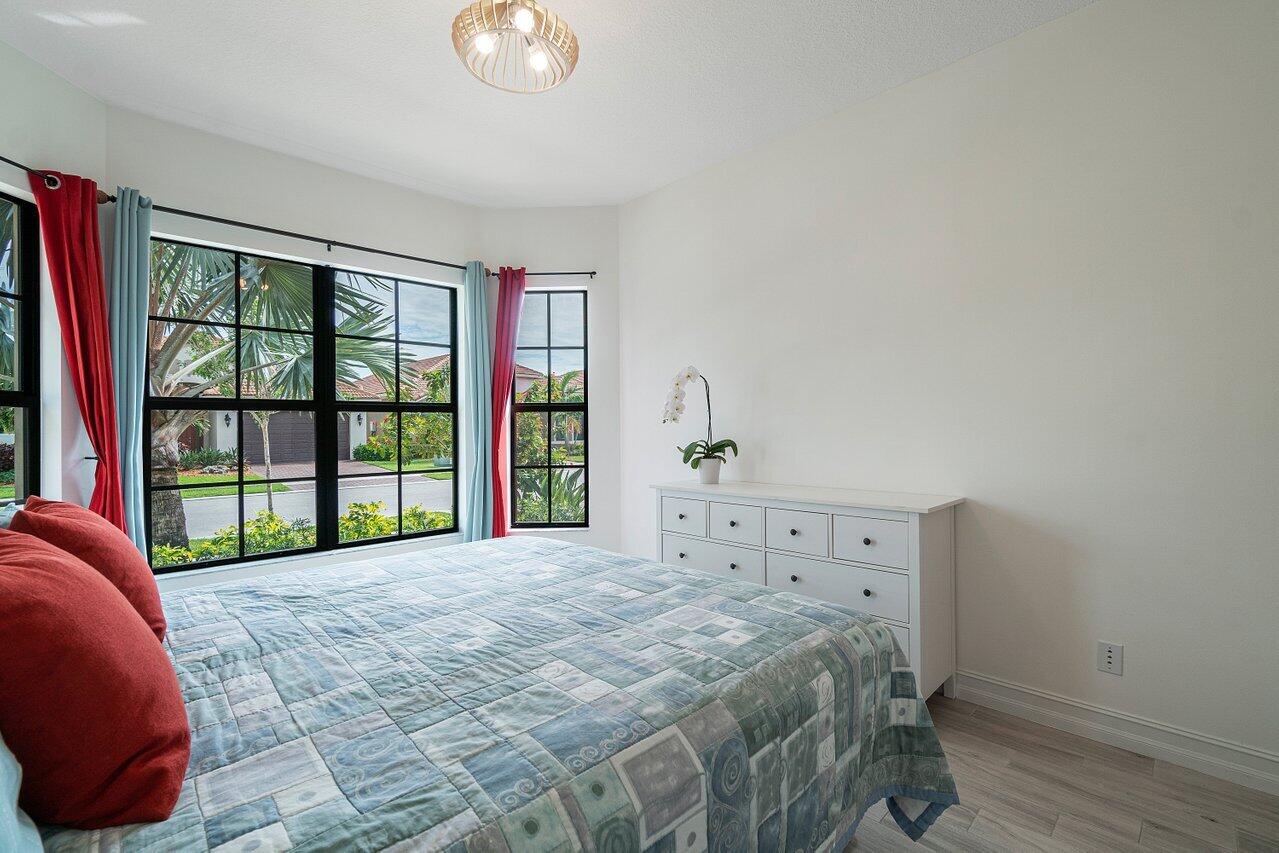 11856 Leon Circle Parkland, FL 33076 - Photo 14 of 43 a bedroom with a bed and a window