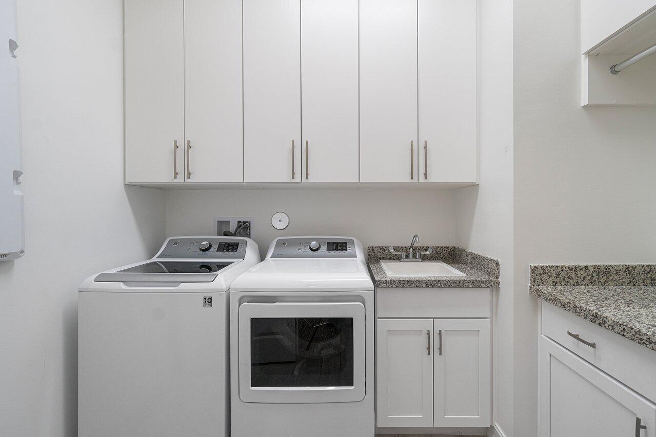 11856 Leon Circle Parkland, FL 33076 - Photo 19 of 43 a utility room with dryer and washer