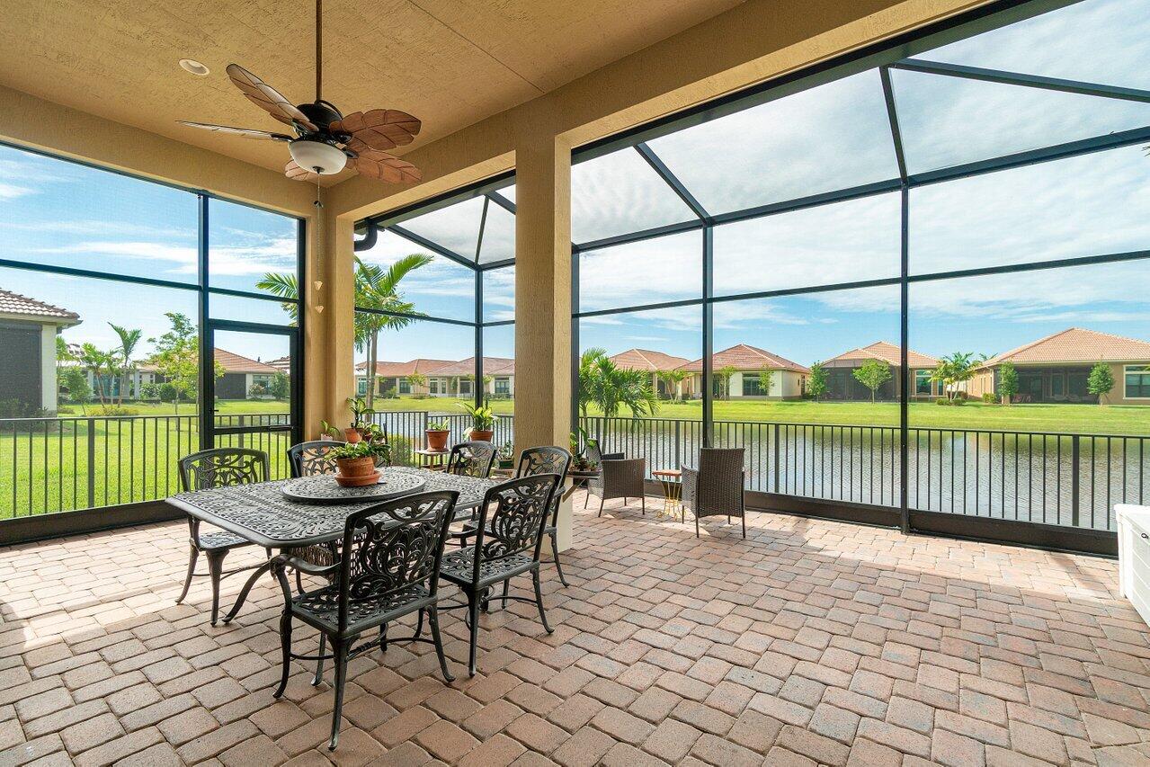11856 Leon Circle Parkland, FL 33076 - Photo 21 of 43 a dining room with furniture and a backyard