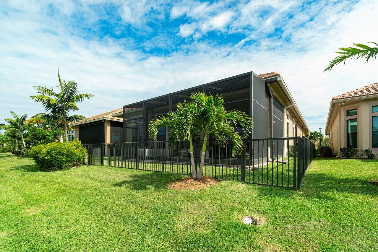 11856 Leon Circle Parkland, FL 33076 - Photo 25 of 43 a view of a house with a yard and plants