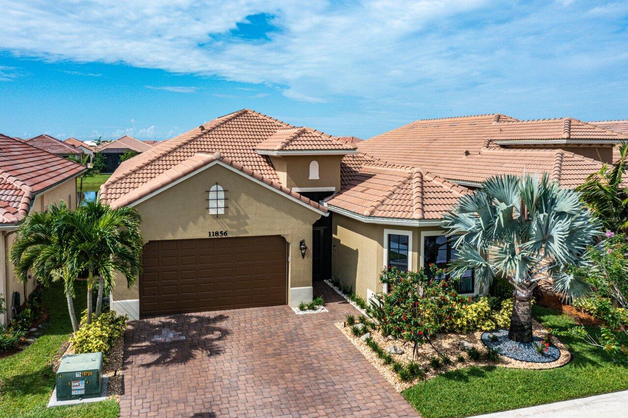 11856 Leon Circle Parkland, FL 33076 - Photo 27 of 43 a view of a house with a yard