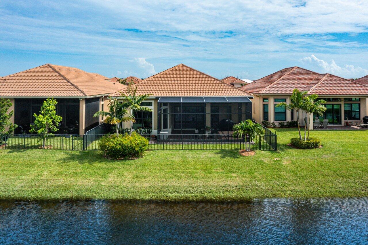 11856 Leon Circle Parkland, FL 33076 - Photo 30 of 43 a front view of a house with a yard table and chairs