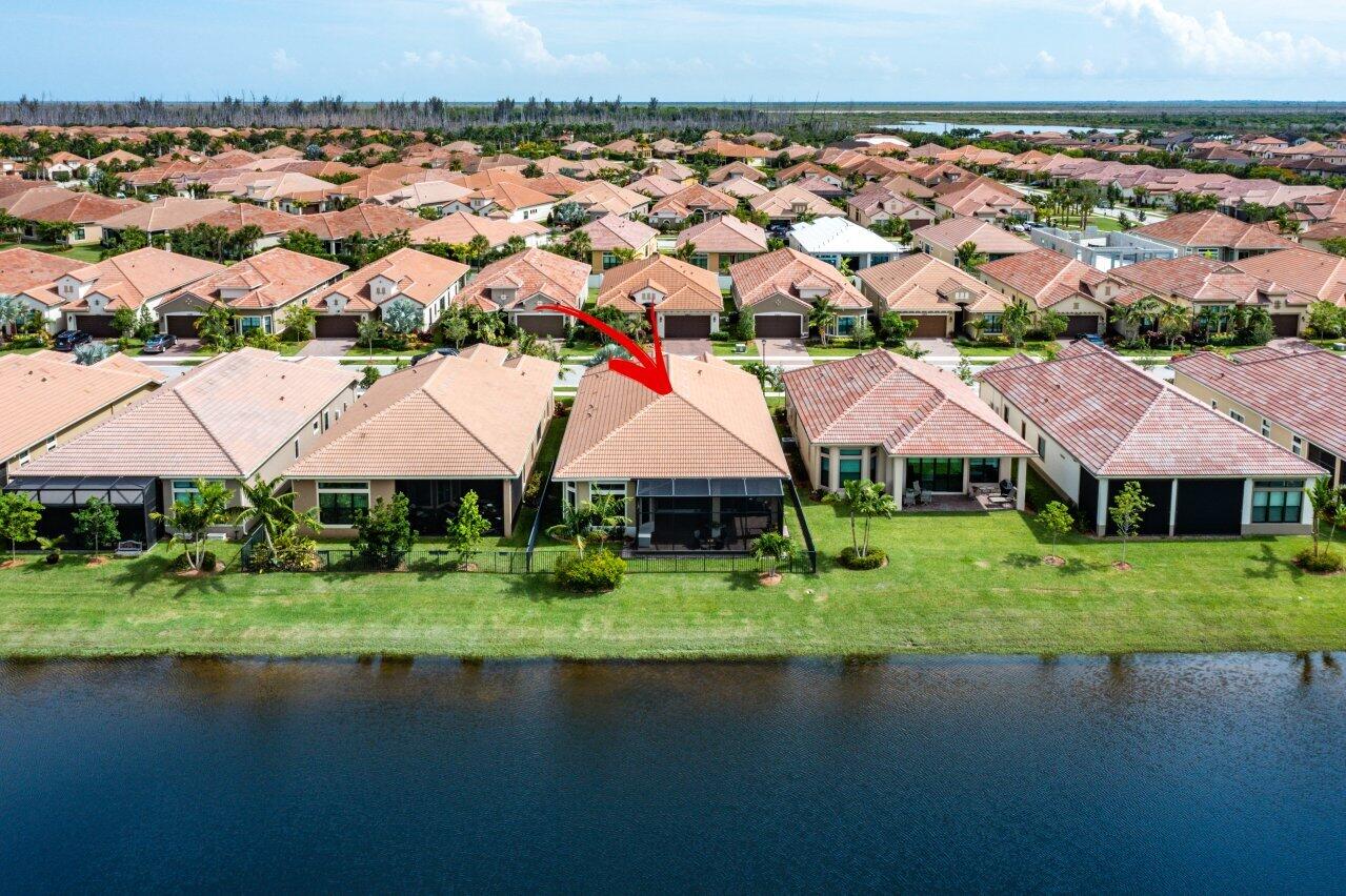 11856 Leon Circle Parkland, FL 33076 - Photo 32 of 43 an aerial view of a house with a yard and lake view