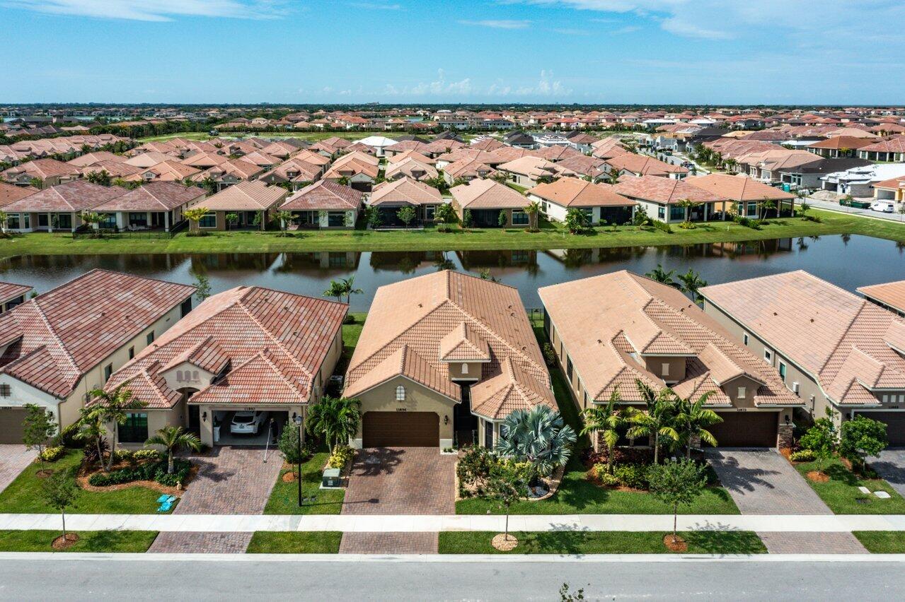 11856 Leon Circle Parkland, FL 33076 - Photo 33 of 43 an aerial view of a house with a lake view