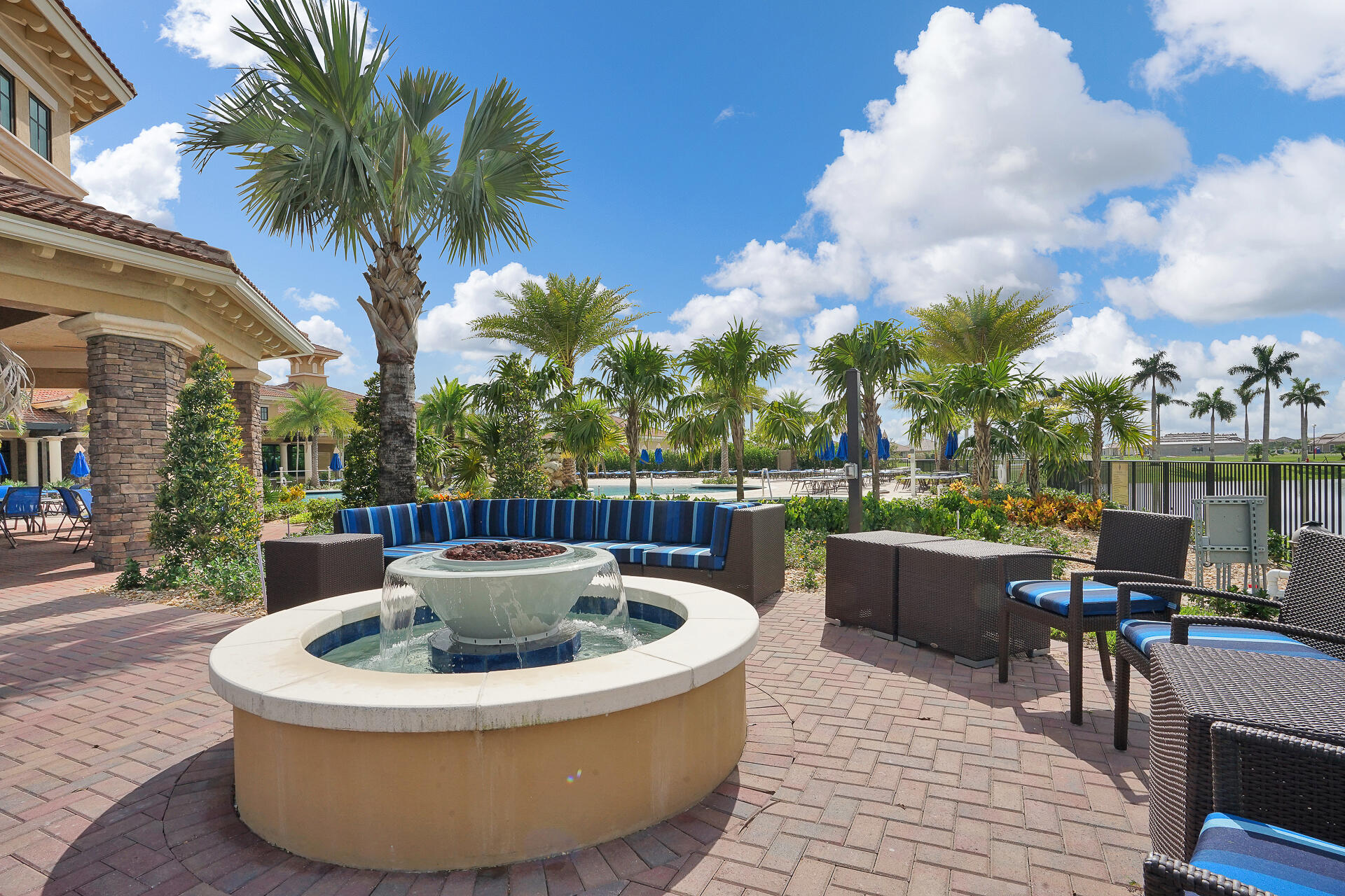 11856 Leon Circle Parkland, FL 33076 - Photo 42 of 43 a view of a swimming pool with outdoor seating