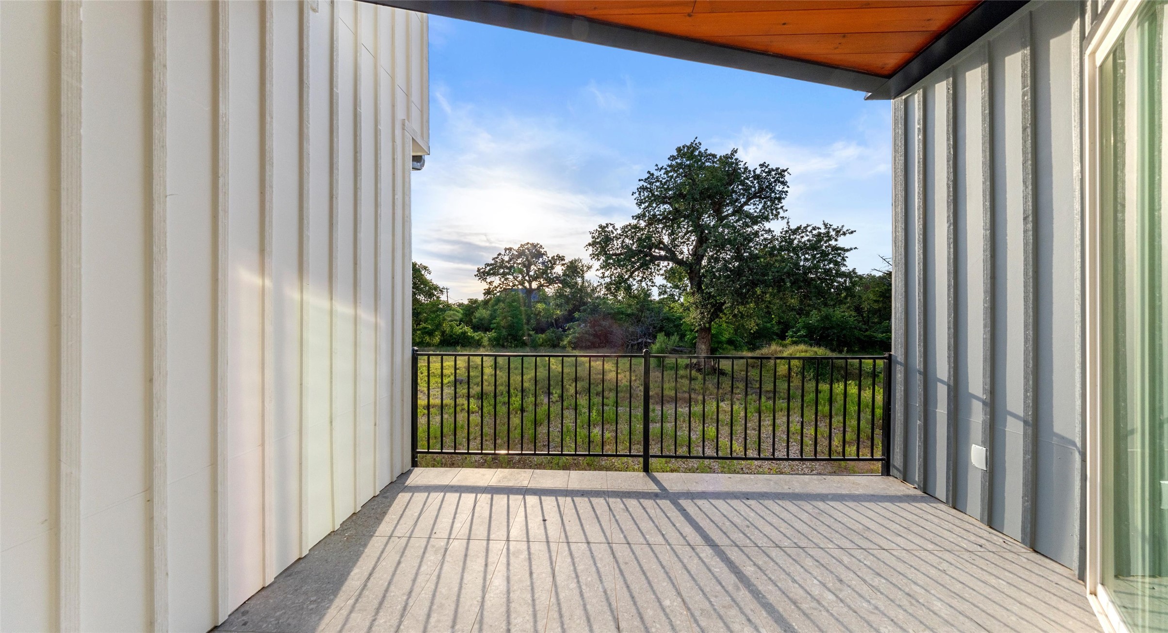 5912 Harold Court, Unit 106 Austin, TX 78721 - Photo 26 of 26 A private covered balcony made for slowing down — enjoy a glass of wine and the East Austin sunset, or morning coffee in the open air. Model No. 104 Shown.