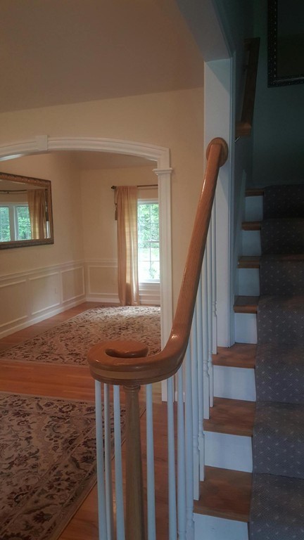 53 Hardwick Road Ashland, MA 01721 - Photo 12 of 18 a view of entryway and hall with wooden floor