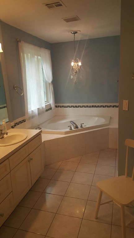 53 Hardwick Road Ashland, MA 01721 - Photo 15 of 18 a bathroom with a sink a vanity and mirror