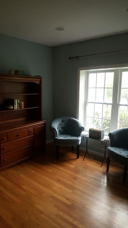 53 Hardwick Road Ashland, MA 01721 - Photo 10 of 18 a living room with furniture and a flat screen tv