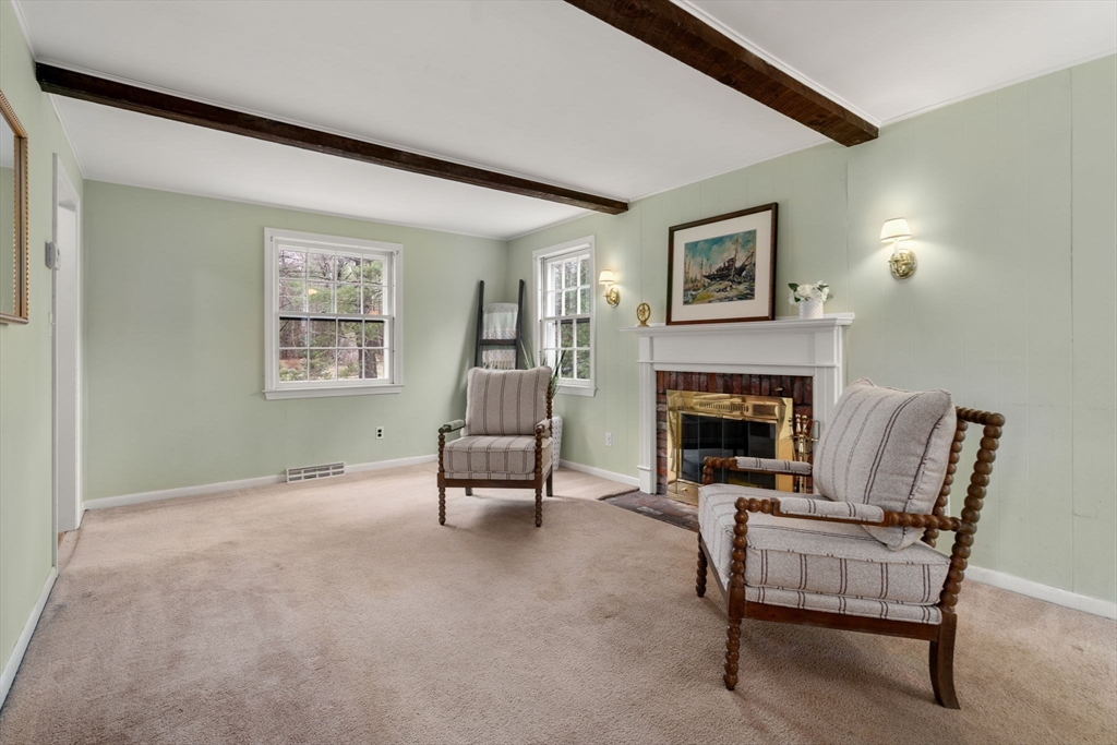 79 Oxbow Road Wayland, MA 01778 - Photo 11 of 30 a living room with furniture and a fireplace